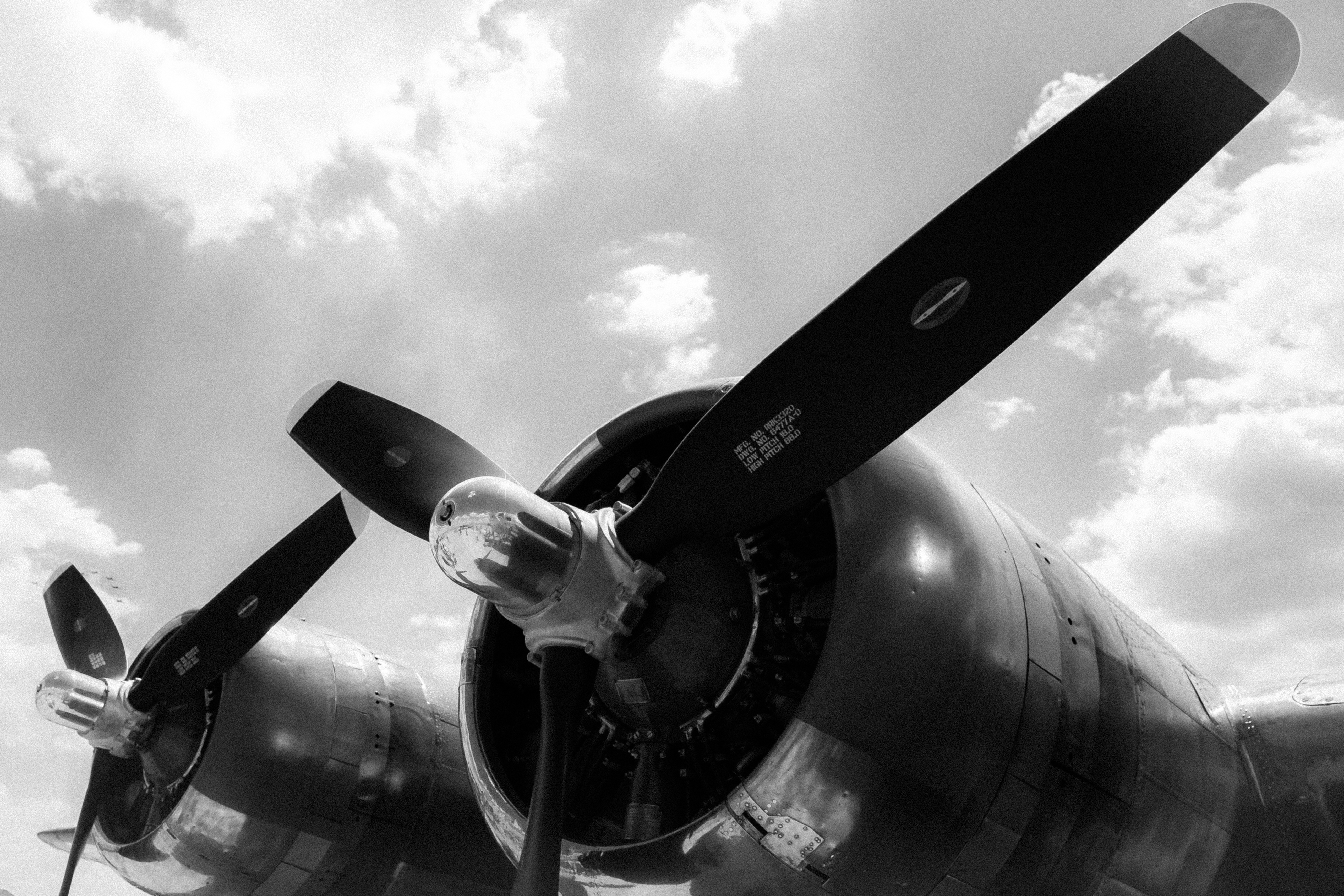 low-angle-greyscale-shot-two-propellers-plane-ready-takeoff-1-69a1d80e26bf4.jpg